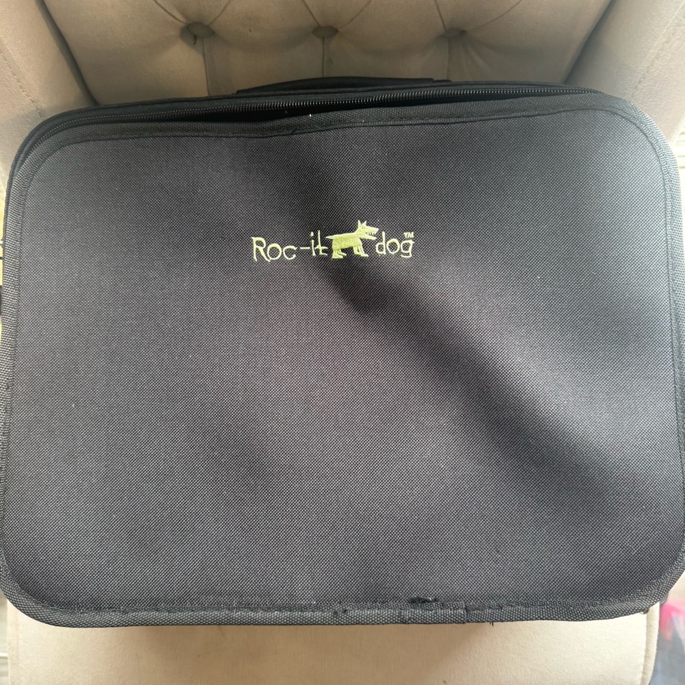Roc-It Dog Beauty Supply Case. The top has a crease but zips and no holes.